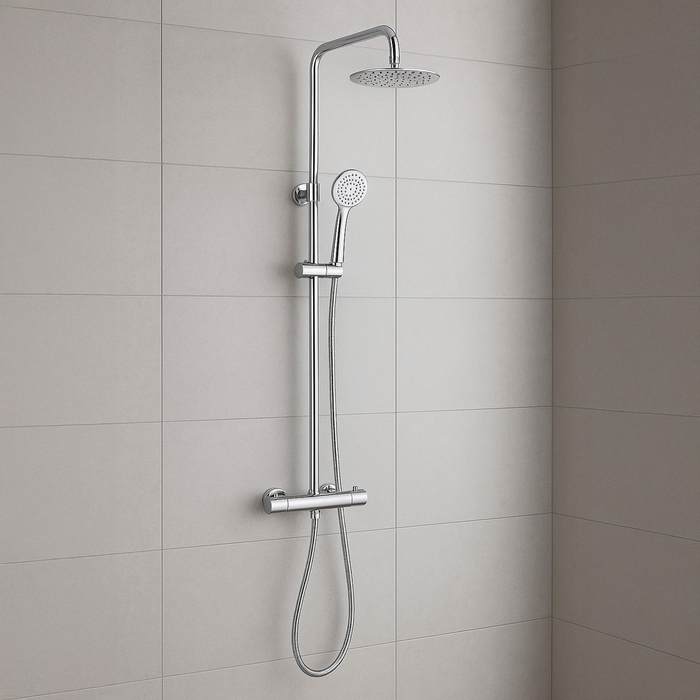 Chrome shower system mounted on a tiled bathroom wall