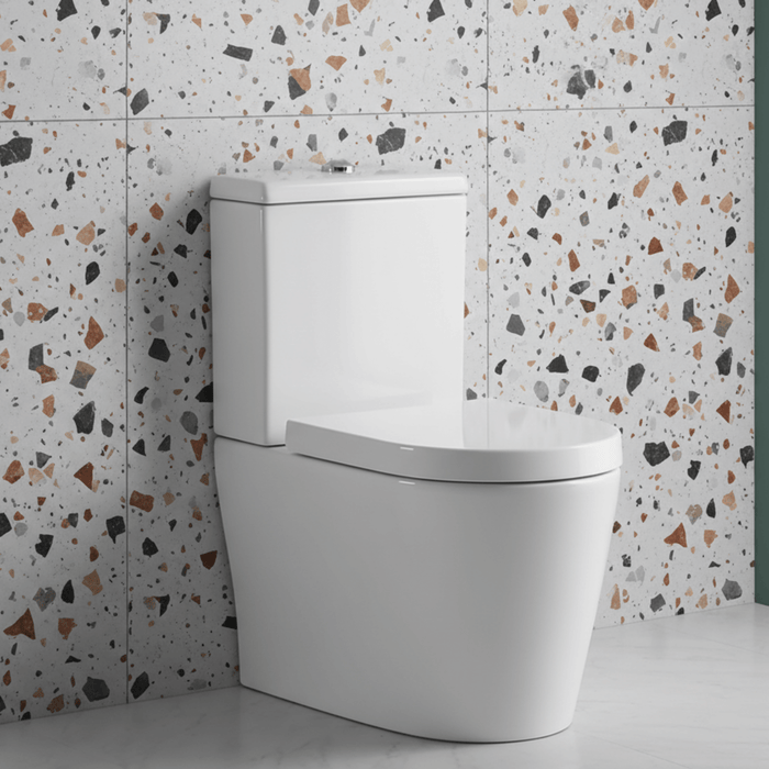White toilet against a terrazzo-patterned wall with a green accent.
