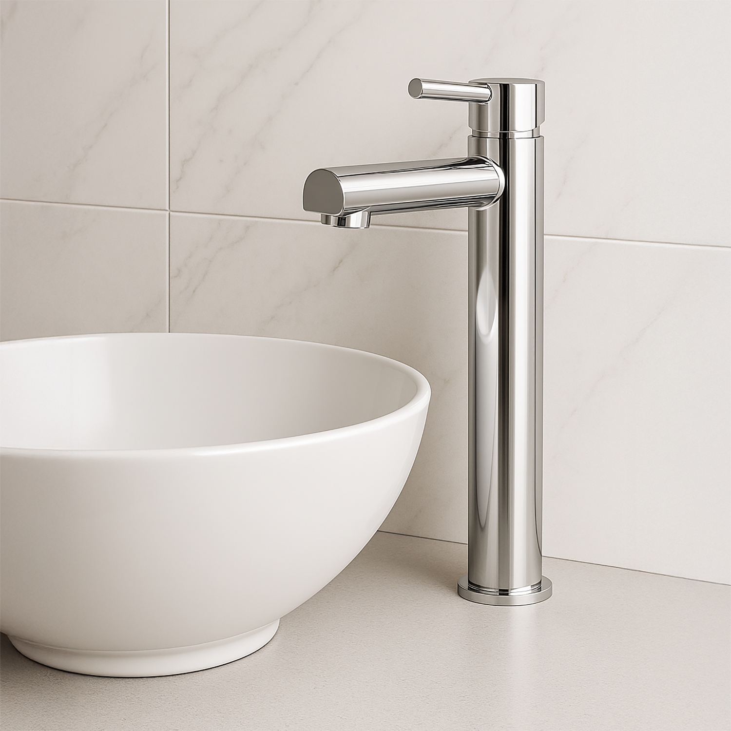 Modern bathroom faucet next to a white sink against a tiled wall.