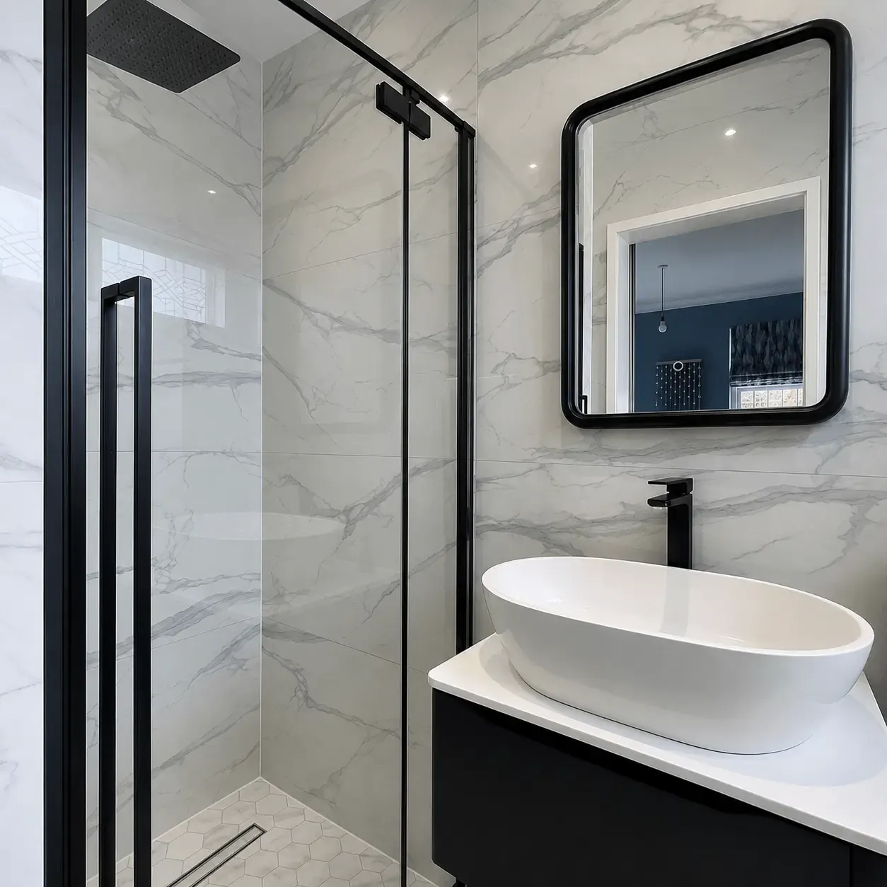 Marble-effect shower room with a black-framed screen and countertop basin