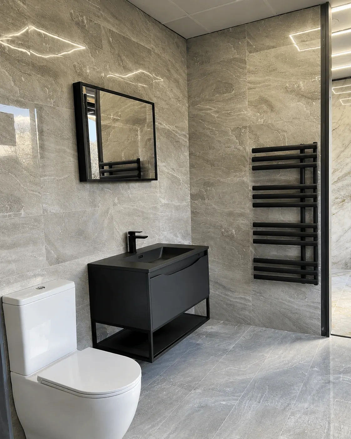 Grey tiled bathroom with a black vanity and matching towel radiator