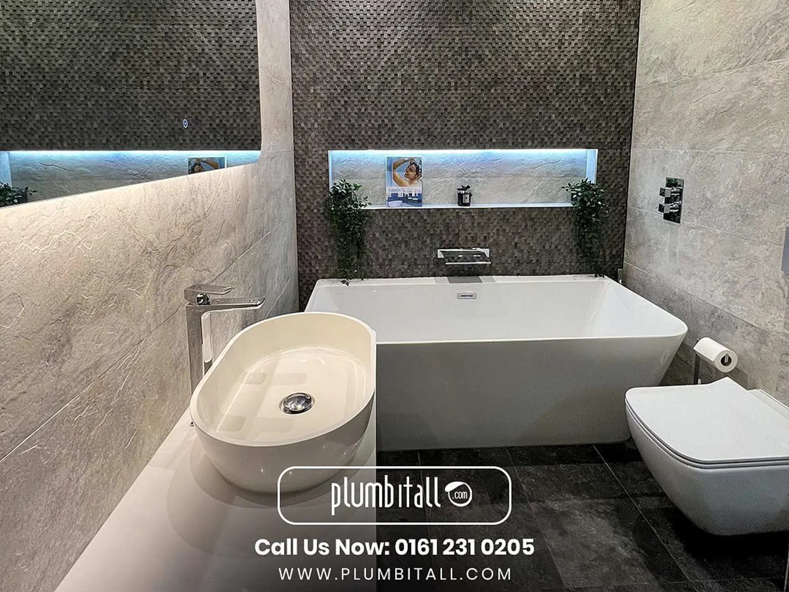 Family bathroom with a freestanding bath, countertop basin and illuminated mosaic recess