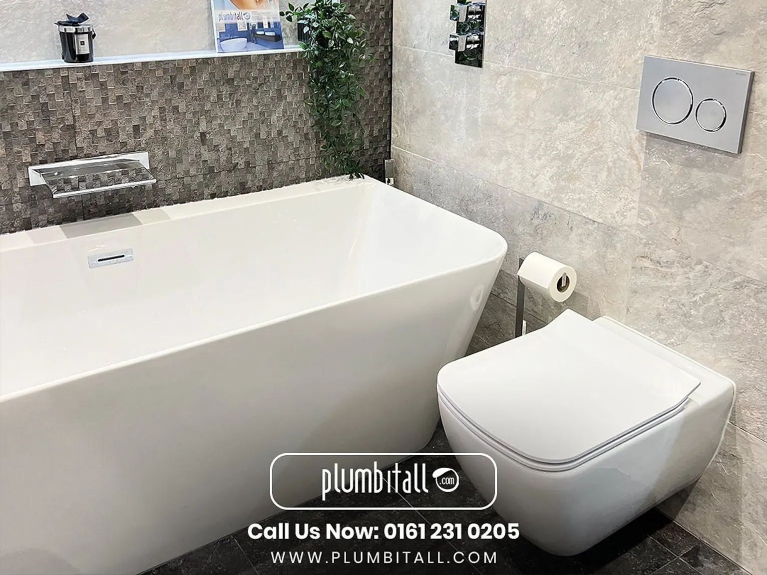 Freestanding bath beside a wall-hung toilet in a tiled family bathroom