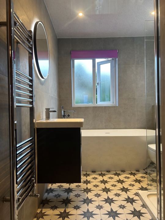 Stars at your feet ✨ This previous clients renovation pairs a freestanding bath and floor-standing chrome filler with bold star-patterned ti…
